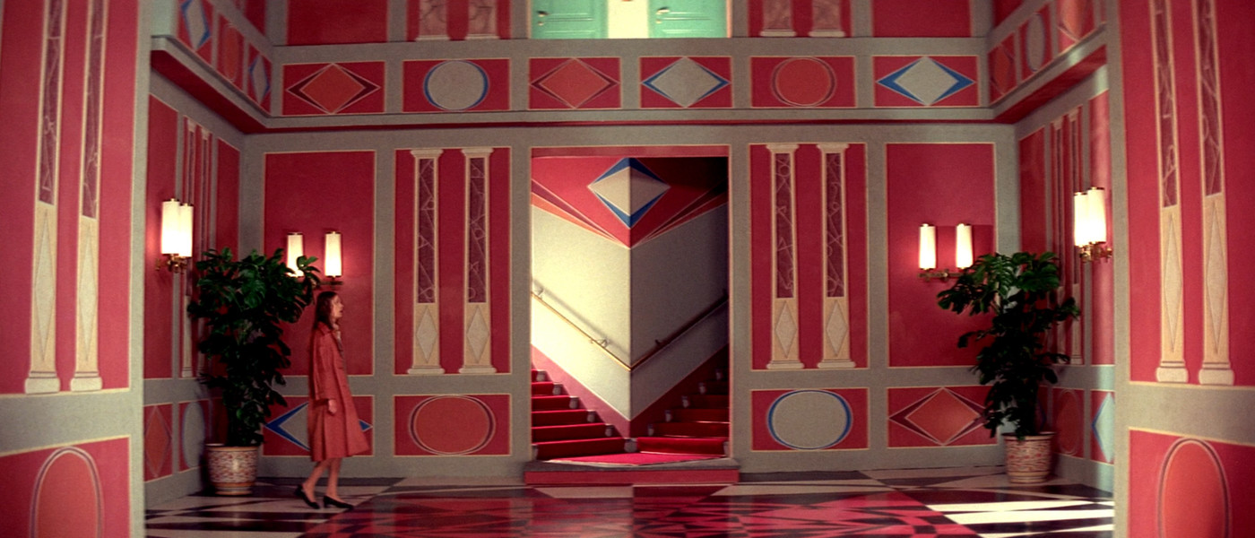 Red / tan hallway scene from Suspiria